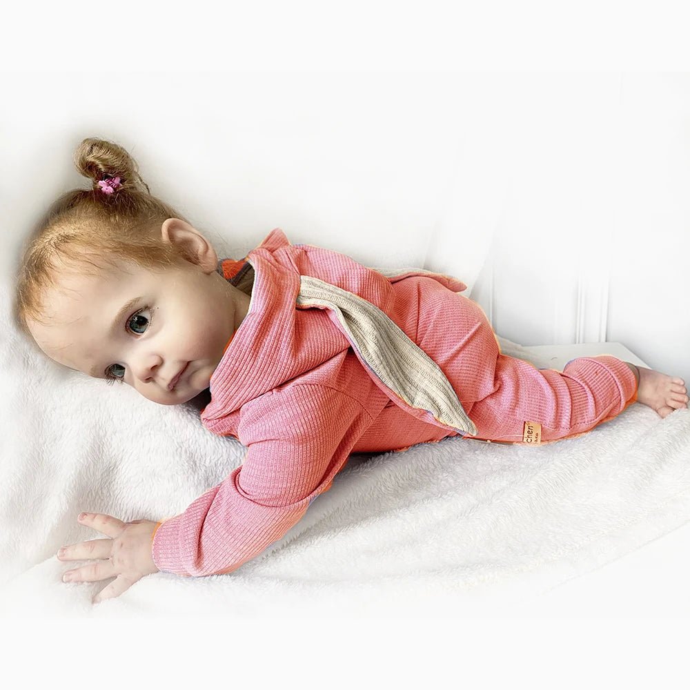 Maggi Reborn Baby Doll 58cm handmade with lifelike silicone finish in a pink outfit for nursery display and gifting.