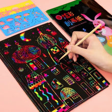 Magic Rainbow Scratch Art Card Set, scratch art kit with colorful designs on a black surface, for travel bag quiet-time activities.