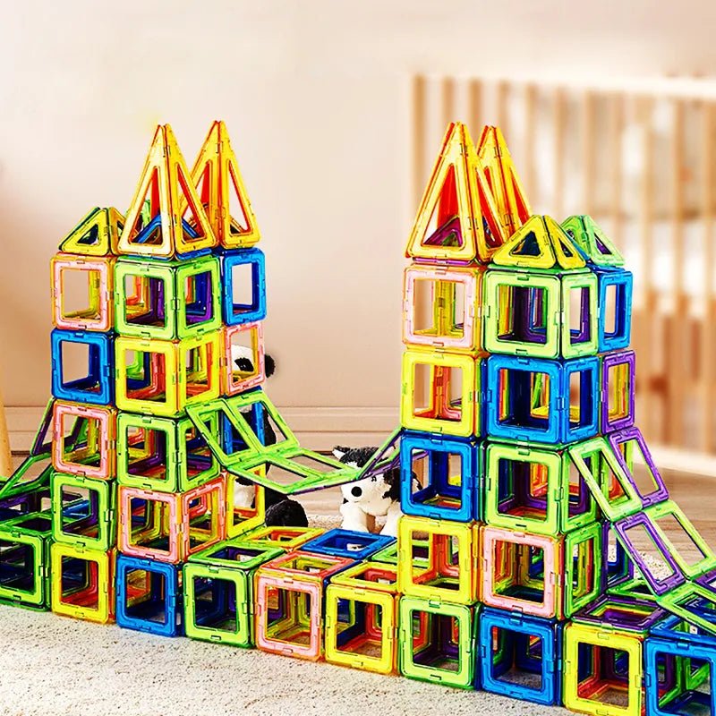 Magnetic Building Blocks, colorful magnetic building blocks stacked into a castle-like structure on a light surface, for hands-on shape and color recognition play.