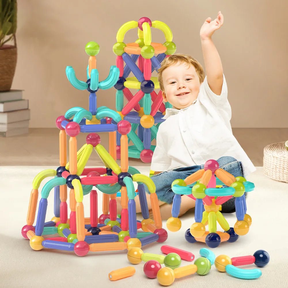 Magnetic Building Sticks, child playing with colorful magnetic building blocks, for STEM building and engineering play.