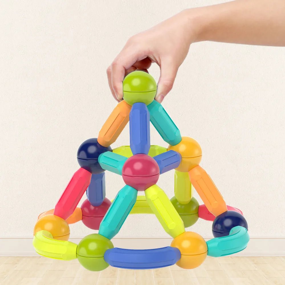 Magnetic Building Sticks, colorful magnetic building toy being held by a hand, for gifting to preschoolers and toddlers.