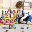 Child playing with colorful magnetic building blocks