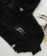 Black hoodie and shorts set with 'ma ma' embroidery.