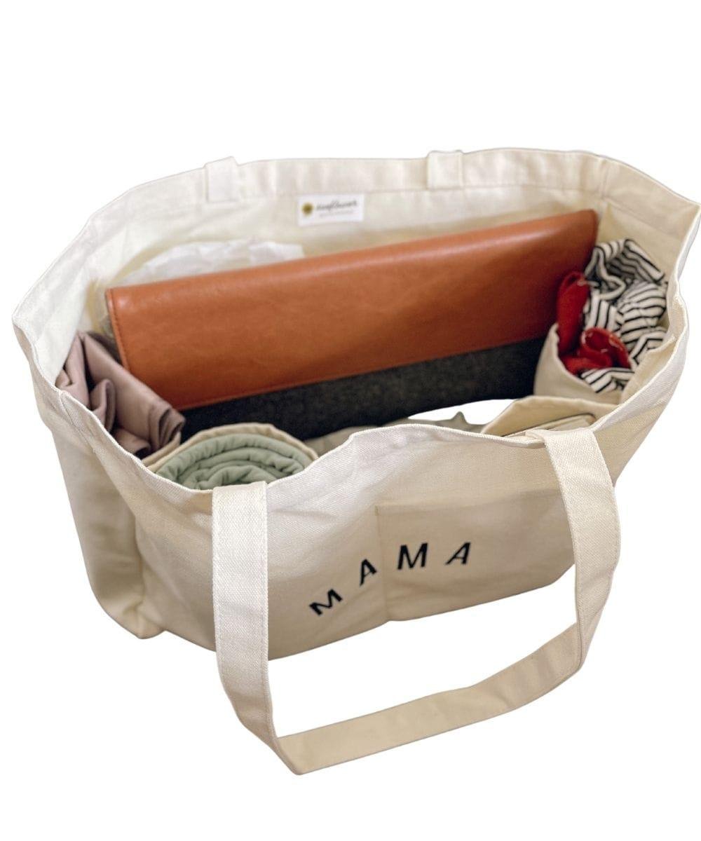Beige tote bag labeled 'MAMA'.