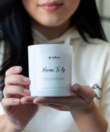 Mama To Be soy candle held as a thoughtful gift for baby showers and pregnancy announcements.
