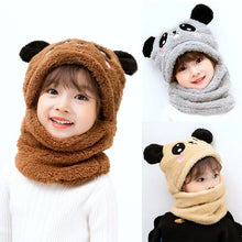 Three children wearing animal-themed beanies in brown, gray, and beige.