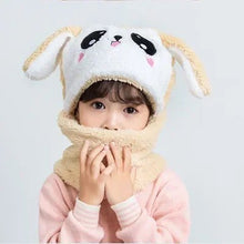 Child wearing a cartoon animal hat and scarf.