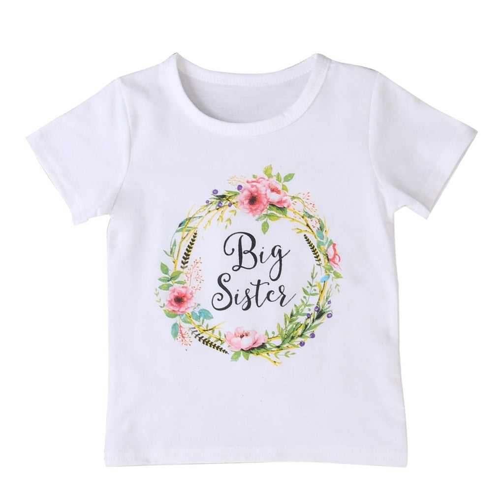 White t-shirt with floral design and 'Big Sister' text 