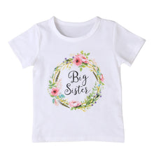White t-shirt with floral design and 'Big Sister' text 