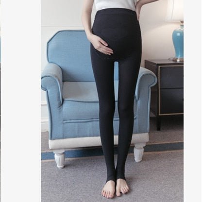 Maternity belly legging in black worn by a model for daily pregnancy comfort and support.