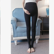 Maternity belly legging in black worn by a model for daily pregnancy comfort and support.