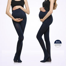 Pregnant woman wearing navy adjustable maternity belly legging for supportive daily wear.