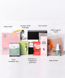 Pregnancy Box collection of maternity care products laid out for daily pregnancy skincare, comfort, and nausea relief.