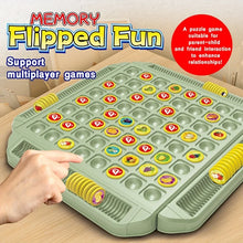 Hand flipping a playing piece on the green Memory Flipped Fun board with yellow storage slots