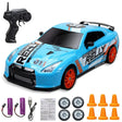 Blue toy race car with remote control, batteries, and accessories.