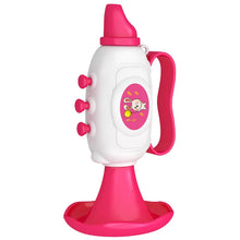 Pink mini horn toy with a rabbit picture standing on its bell on a white background