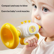 Baby blowing a yellow mini horn toy, second view
