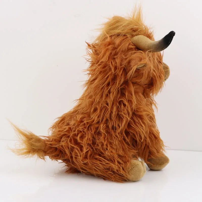 Mini Highland Cow doll in kawaii plush with brown fur, a compact soft toy for travel comfort and stroller company.