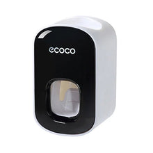 Minimalist black and white wall mounted toothpaste dispenser set for clutter-free bathroom storage.