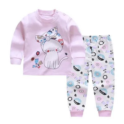 Children's pajama set with a pink top and patterned pants.
