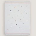 Folded blanket with a colorful polka dot pattern