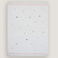 Folded blanket with a colorful polka dot pattern