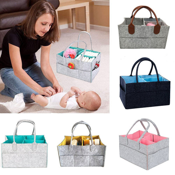 Woman with a baby beside foldable diaper caddy baskets in different colors for nursery organizing.