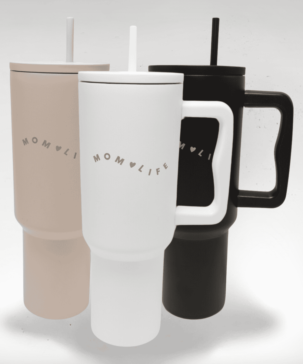Three travel mugs with handles in beige, white, and black, featuring 'MOMLIFE' branding.