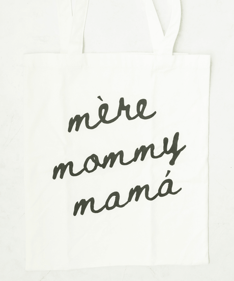 White tote with 'mère mommy mamá' text.