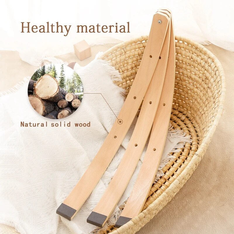 Montessori wooden play gym frame with mobile toys styled in a natural wood nursery setting for daily play.