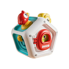 White pentagon busy cube with a red door panel and a bird figure