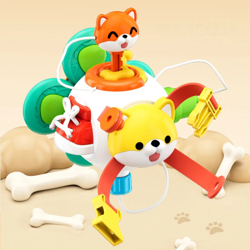 Busy cube with a fox figure on top and a dog face on the front, surrounded by bone decorations