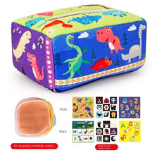 Montessori Magic Tissue Box soft book with dinosaur illustrations included for baby sensory learning.