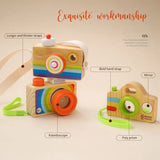 Wooden toy camera with a colorful design.