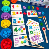 Educational children's toys with numbers, letters, and colorful beads on a blue surface.