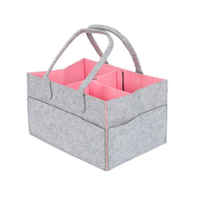 Gray multi-pocket diaper caddy with pink interior for organizing wipes and nappies.