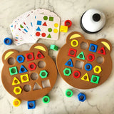 Two bear-shaped educational toys with colorful geometric shapes.
