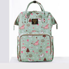 Green backpack with pink animal pattern.
