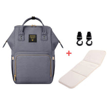 Gray backpack with additional items 