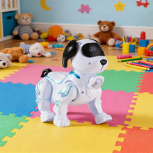 White robot dog with black ears standing on a colorful foam mat with toys and crayons behind it