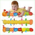 Musical caterpillar rattle with ring bell played by a child for sensory play and early motor skill development.