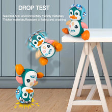 Toy penguin falling from a small table with text about material safety.