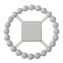 White silicone teething ring with a square handle.