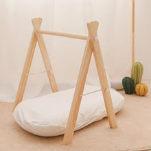 Close-up of the natural wood baby teether hangers used for soothing sore gums during the teething months.