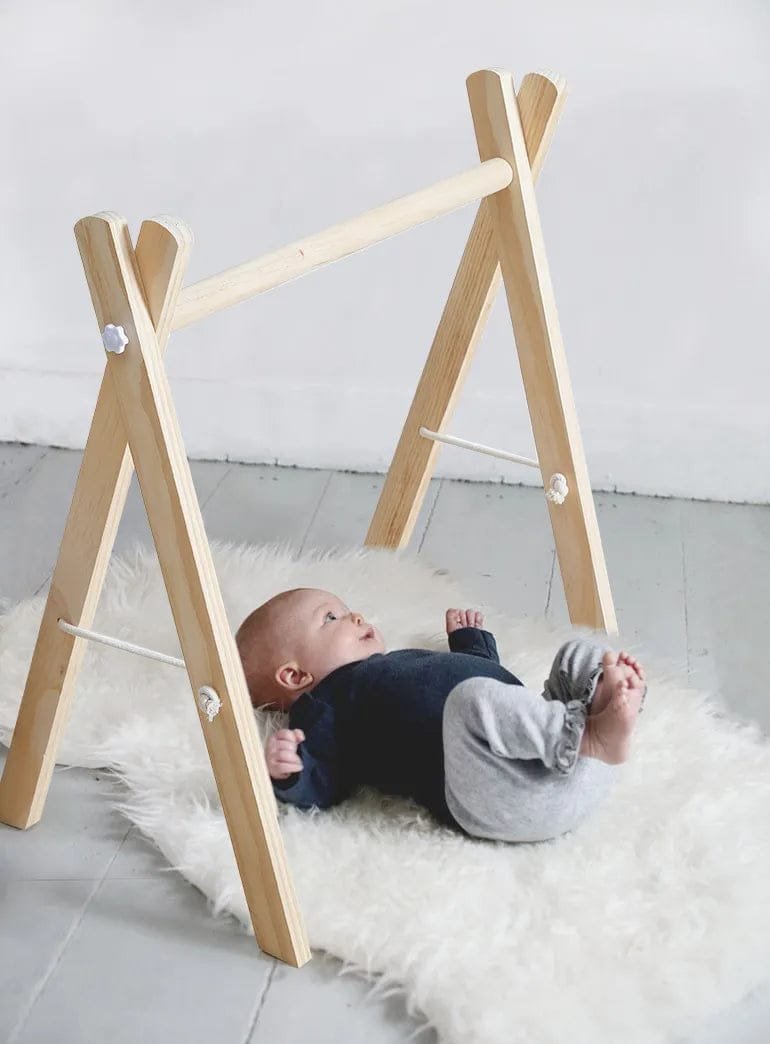 Natural wooden baby gym and teether set with cloud and rodent hangers for newborn tummy time and sensory play.