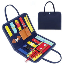 Navy blue Montessori Busy Board travel organizer holding colorful toddler learning components.