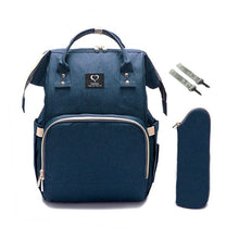 Navy waterproof nursing backpack with stroller straps, built for carrying nappies, bottles, and changes of clothes while travelling.