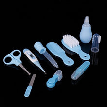 Newborn baby tool kit shown open with grooming tools arranged for nail care and hygiene at home.