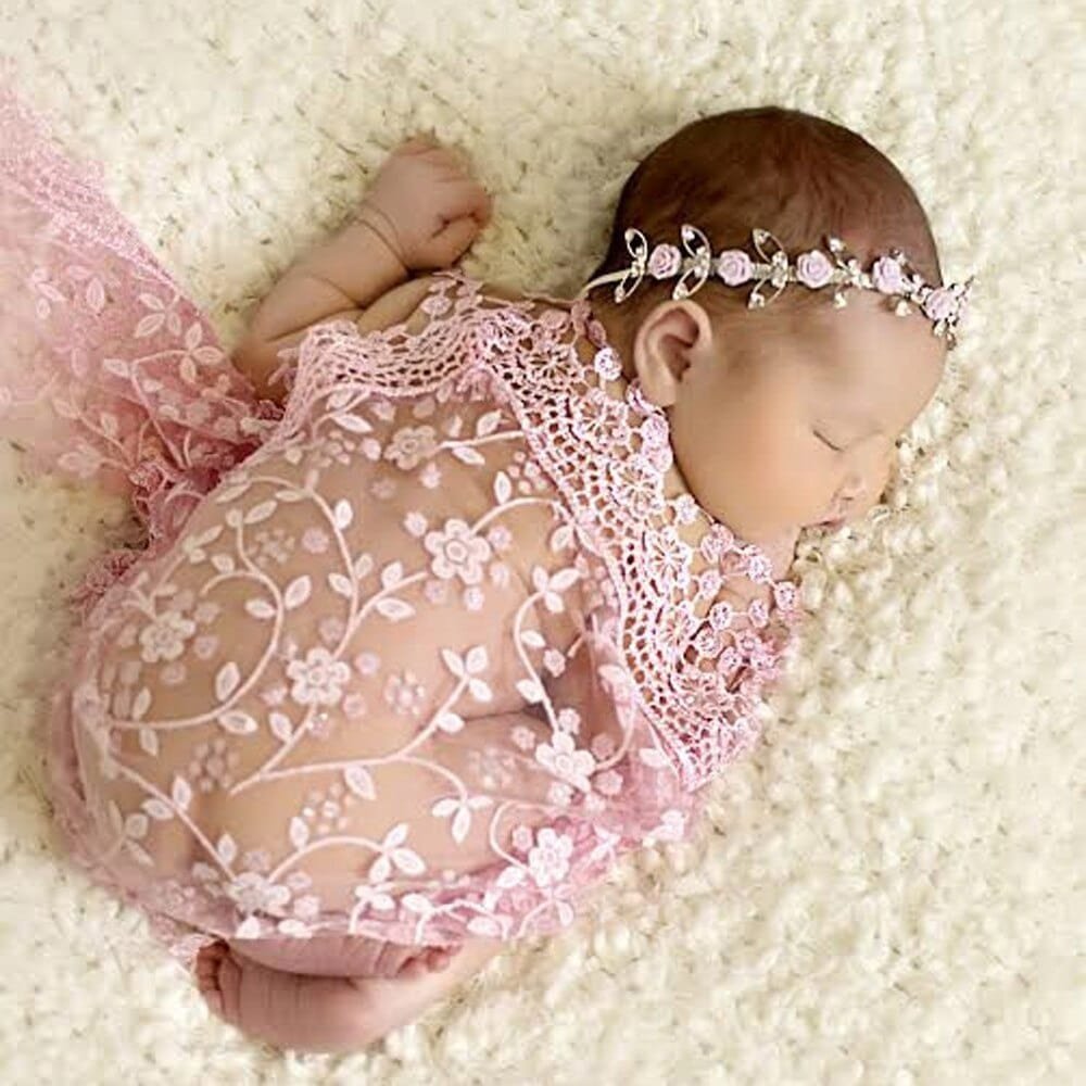 Newborn pink lace wrap and headband in use for baby portrait sessions and first photo memories.