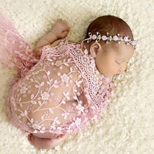 Newborn pink lace wrap and headband in use for baby portrait sessions and first photo memories.